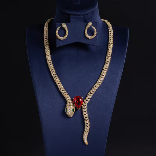 Serpent Gold necklace & earring set with red gemstone